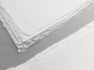 Handmade deckle edge paper in ivory